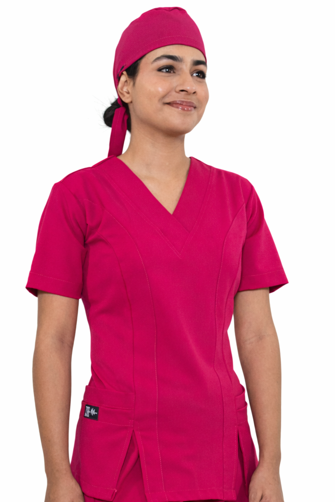 Doctora con scrub Mexico Rose, color rosa, de ISH Outfitters, uniforme elegante y funcional